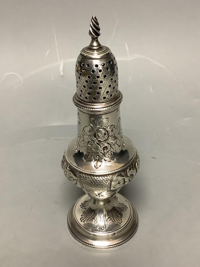 A George III silver baluster caster, with later embossed decoration, Thomas Shepherd, London, 1785, 15.5cm